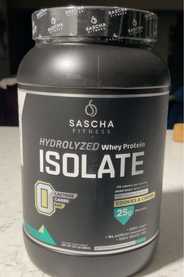 Two athletic supplement jars labeled Creatine Monohydrate and Creatine HCL on a counter in a gym