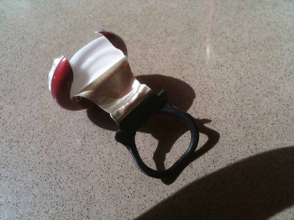 Sleek modern smart ring worn on a finger displaying active biometric tracking